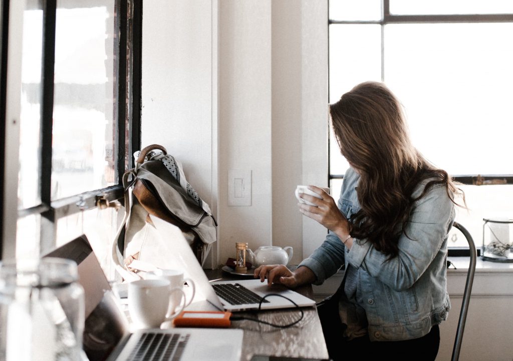 woman writing high quality cornerstone content