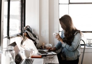 woman writing high quality cornerstone content