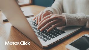 Woman typing on laptop