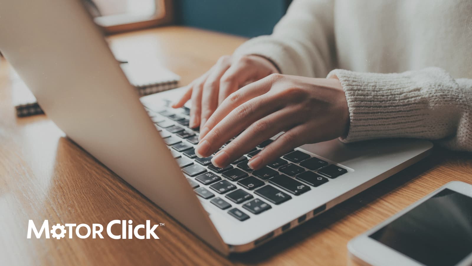 Woman typing on laptop