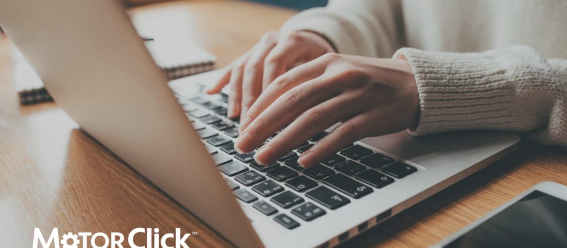 Woman typing on laptop