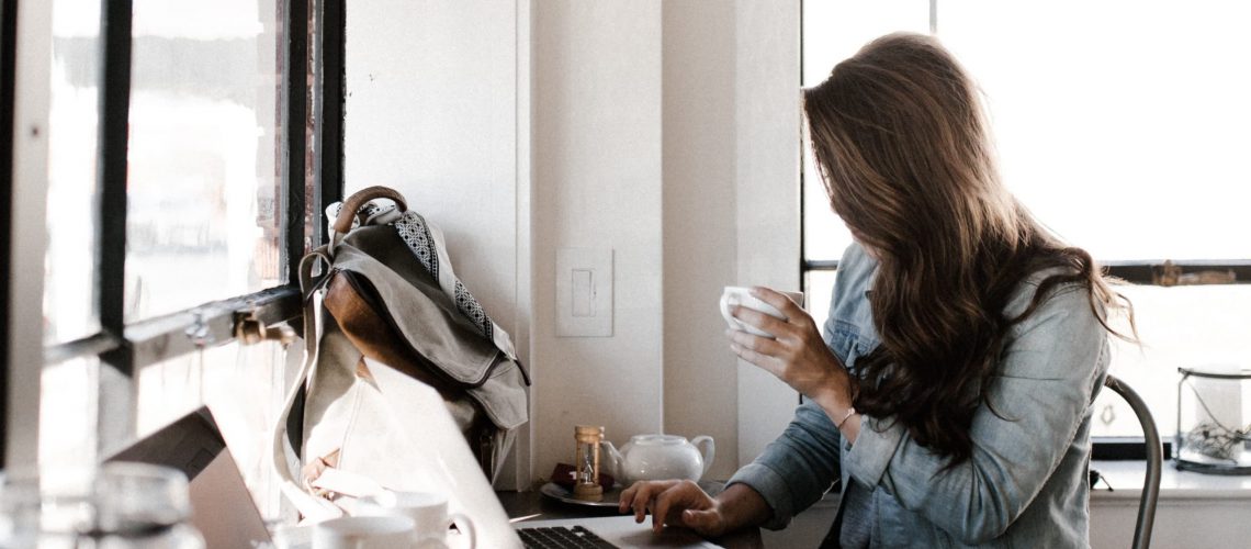 woman writing high quality cornerstone content